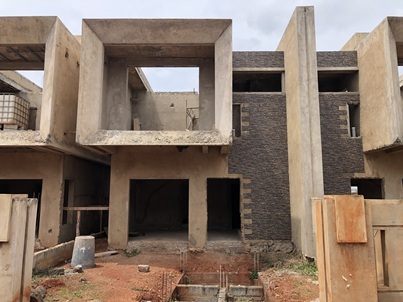 uncompleted 3 bedrooms with out-houses for sale.