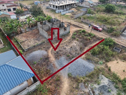 Plot of land with an uncompleted storey for sale.